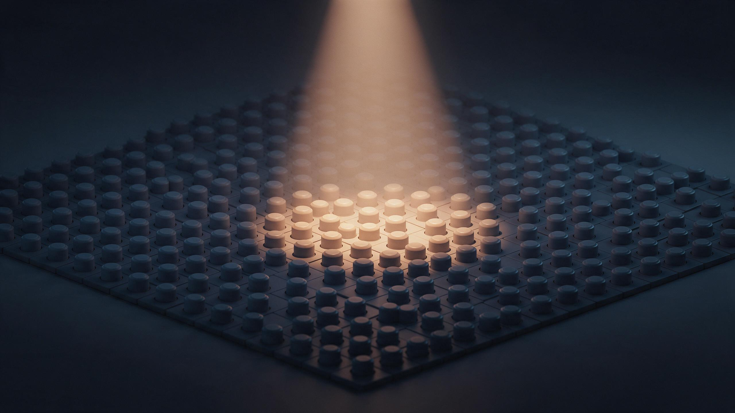 A single cone of light shines down on a small cluster of switches within a vast dim grid, illuminating only that handful in sharp detail